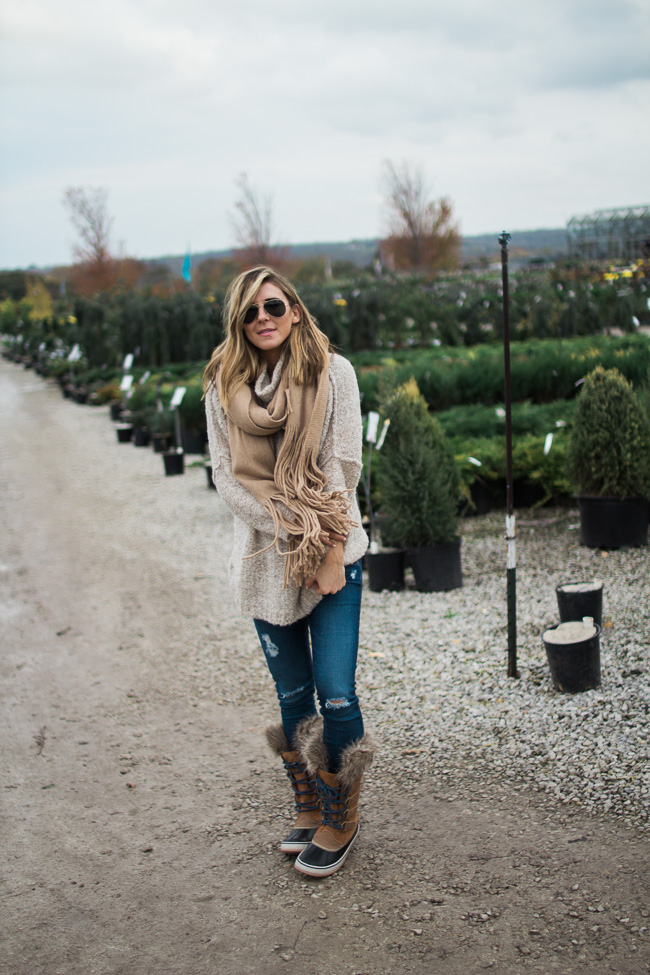 over the knee boots and jeans